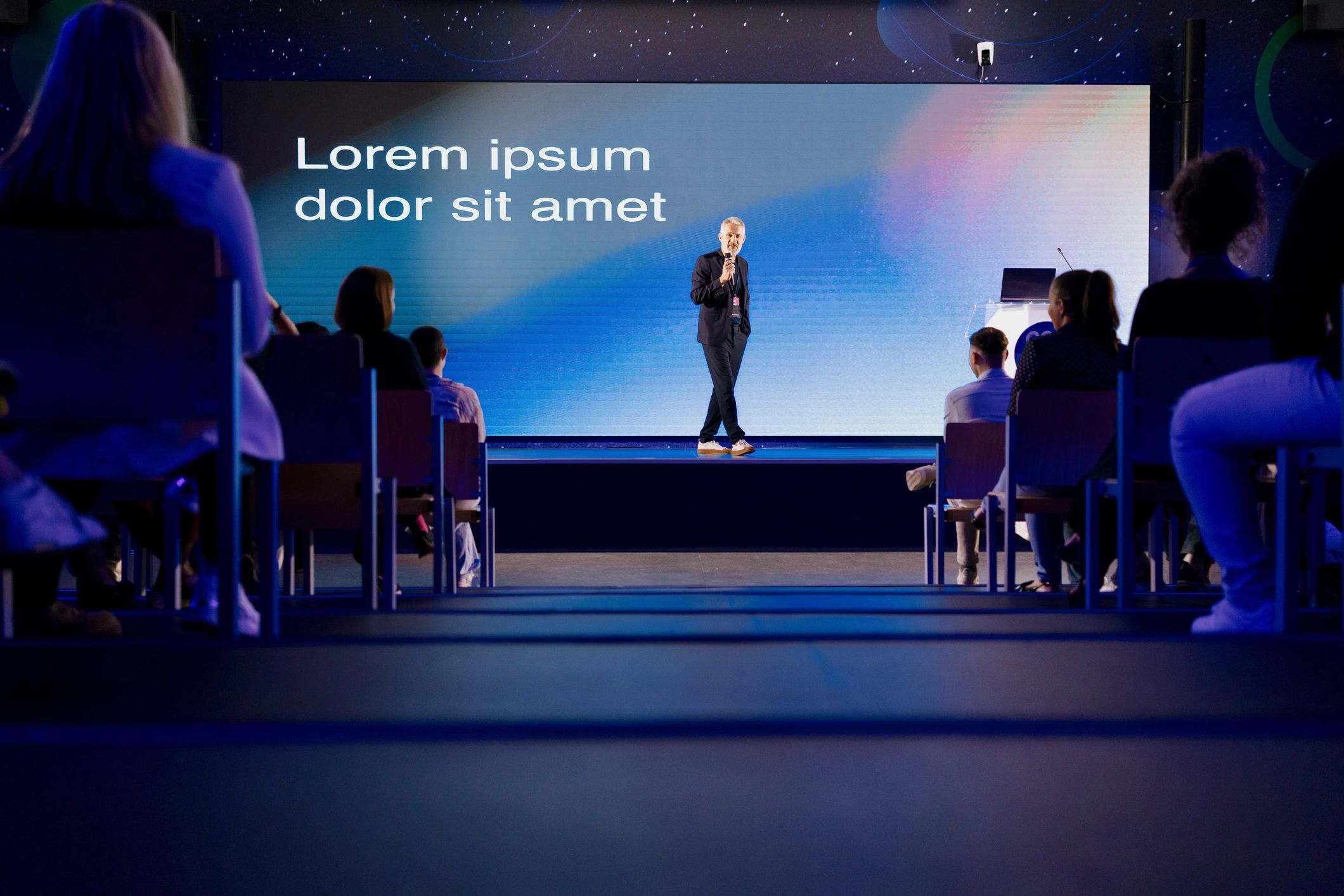 professional speaker on stage business conference